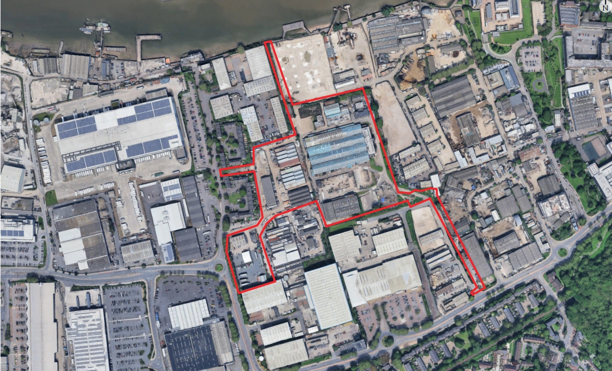 Aerial view of the site (outlined in red) and surrounding area.